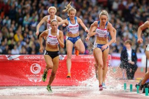 Lennie Waite and Eilish McColgan clear steeplechase barrier in Glasgow 2014 final at Hampden